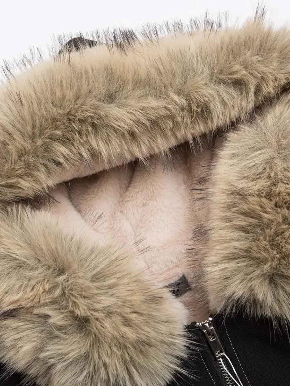 Close-up of a fur-lined hooded garment with a zipper.